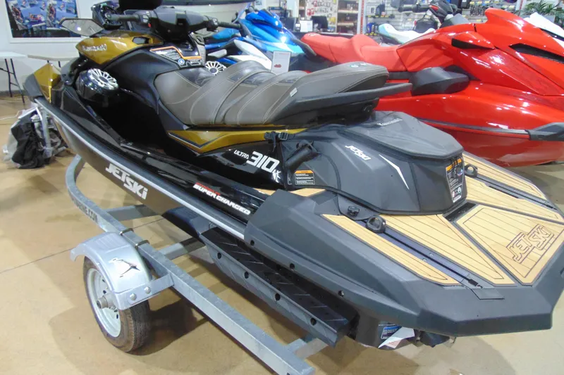 Slide: The Image of 2023 Kawasaki Jetski Ultra 310LX on display in showroom, featuring sleek design and powerful engine. - 5