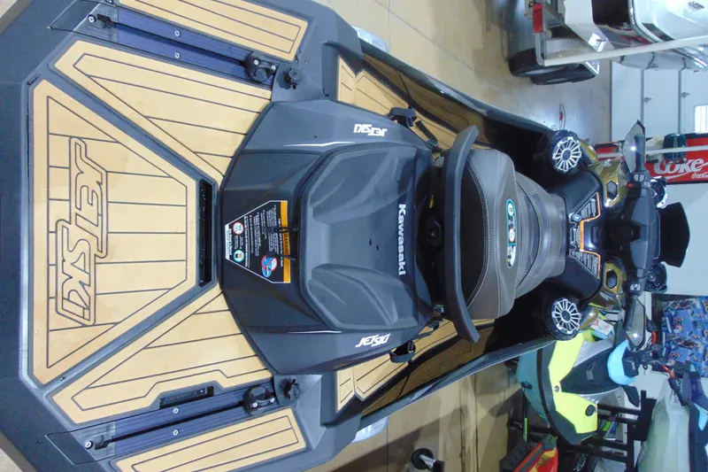 Slide: The Image of 2023 Kawasaki Jetski Ultra 310LX, top view in showroom setting. - 6