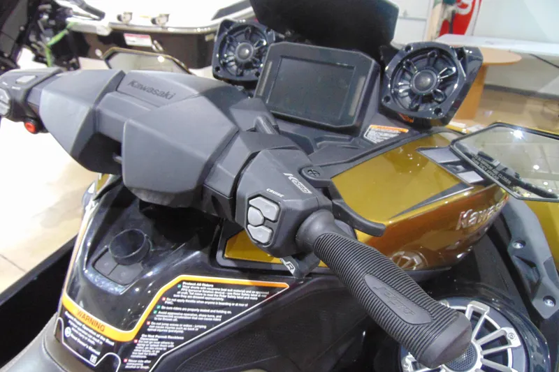 Slide: The Image of 2023 Kawasaki Jetski Ultra 310LX dashboard with controls and speakers. - 8