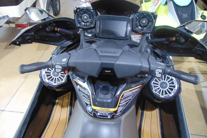 Slide: The Image of 2023 Kawasaki Jetski Ultra 310LX dashboard with controls and speakers. - 9