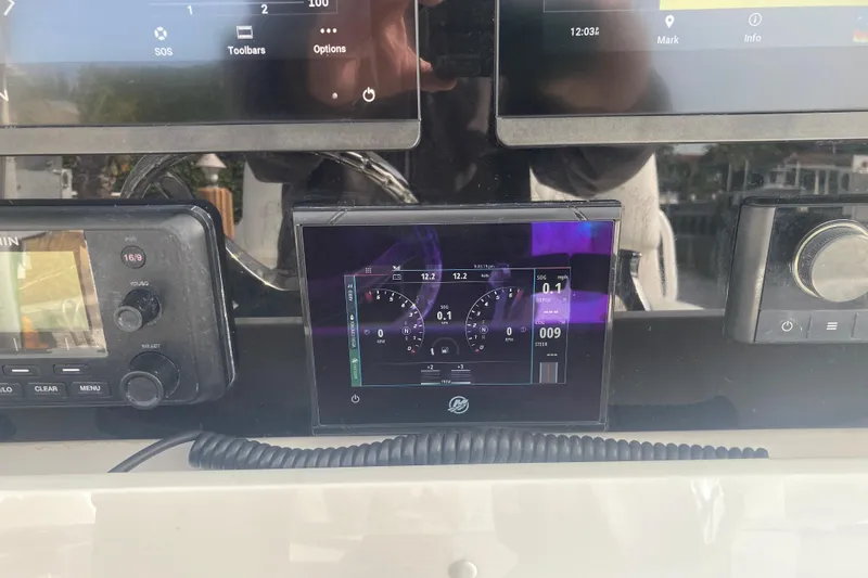 Slide: The Image of Dashboard of a 2020 Invincible 33 Open Fisherman boat with electronic displays. - 11