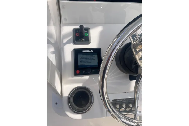 Slide: The Image of Control panel of 2020 Invincible 33 Open Fisherman with Simrad display and joystick. - 13