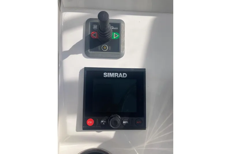 Slide: The Image of Control panel of 2020 Invincible 33 Open Fisherman with Simrad display and joystick. - 19
