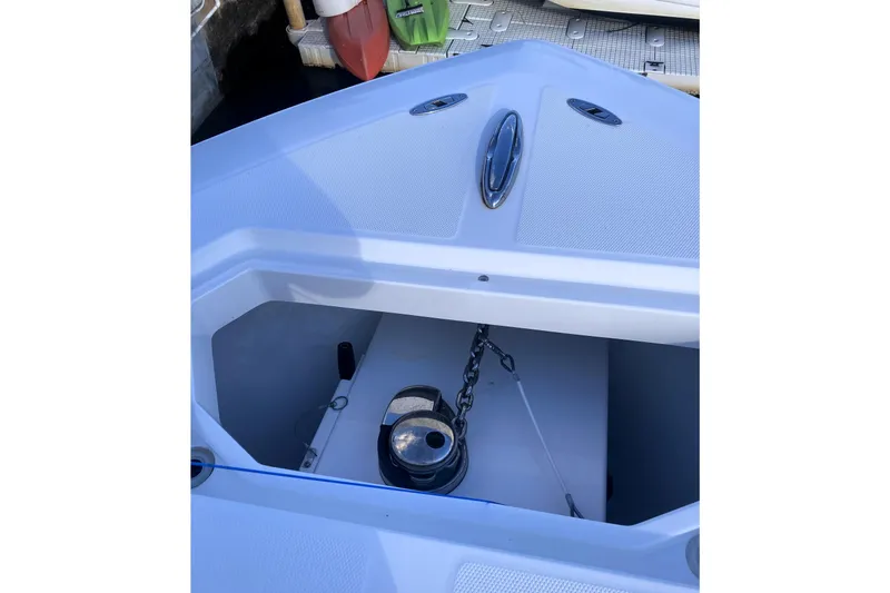 Slide: The Image of 2020 Invincible 33 Open Fisherman anchor locker with chain and winch. - 26