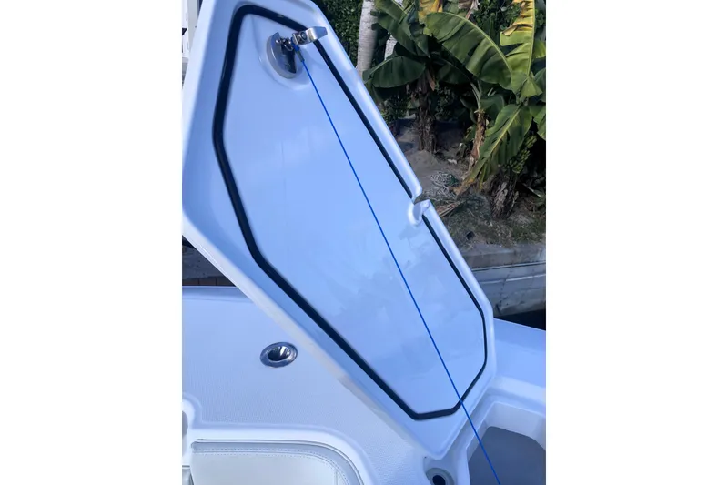 Slide: The Image of 2020 Invincible 33 Open Fisherman boat hatch open, showcasing interior details. - 27
