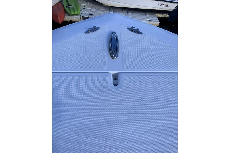 Slide: The Image of 2020 Invincible 33 Open Fisherman boat deck with cleats and textured surface. - 28