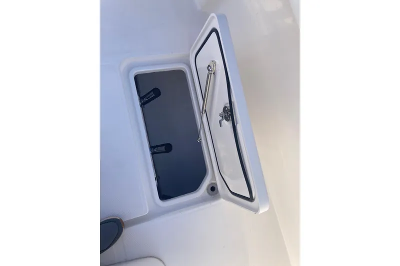 Slide: The Image of Open storage compartment on 2020 Invincible 33 Open Fisherman boat. - 38