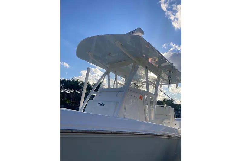 Slide: The Image of 2020 Invincible 33 Open Fisherman boat under a clear blue sky. - 42