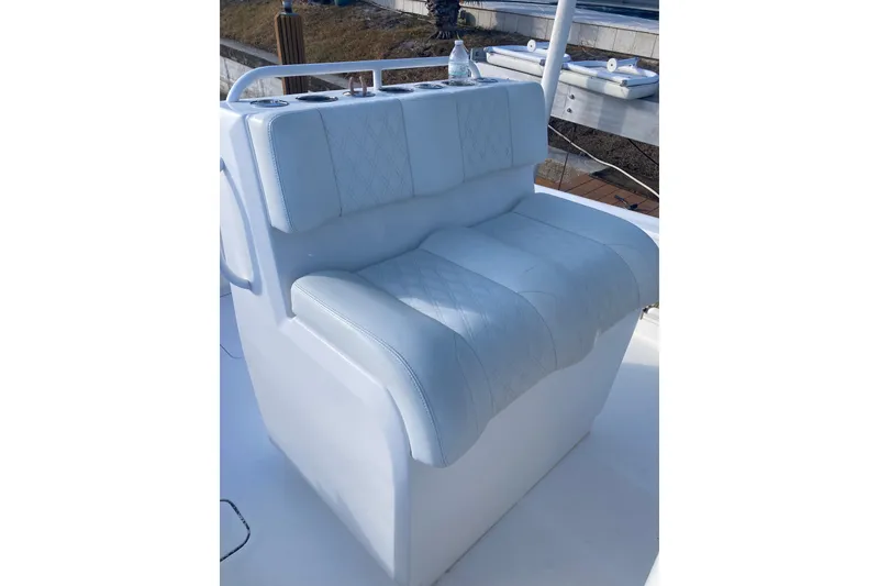 Slide: The Image of 2020 Invincible 33 Open Fisherman boat seat with white cushioned upholstery. - 43