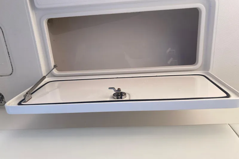 Slide: The Image of Open storage compartment on 2020 Invincible 33 Open Fisherman boat. - 47