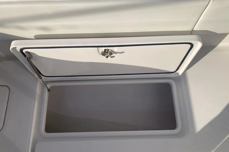 Slide: The Image of Open storage compartment on 2020 Invincible 33 Open Fisherman boat. - 48