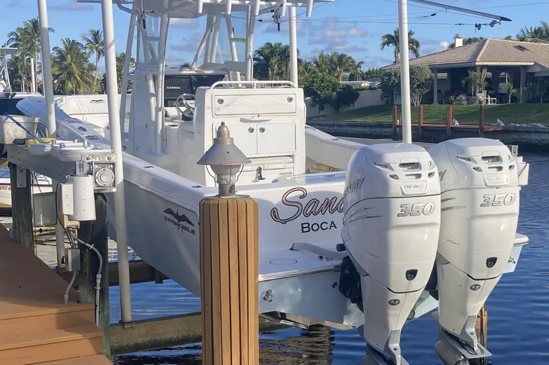 Slide: The Image of 2020 Invincible 33 Open Fisherman boat docked with twin Mercury 350 engines. - 56