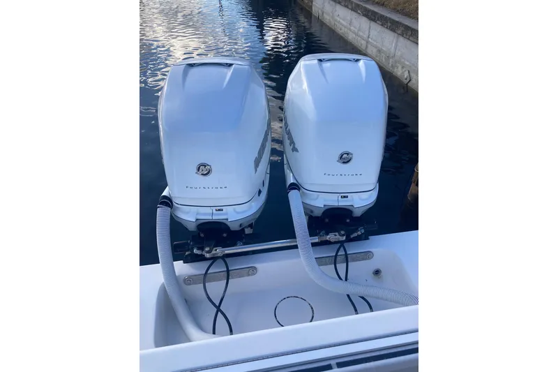 Slide: The Image of Twin outboard engines on a 2020 Invincible 33 Open Fisherman boat. - 57