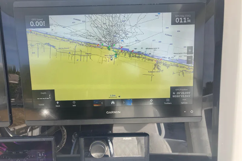 Slide: The Image of Garmin GPS display on 2020 Invincible 33 Open Fisherman boat, showing navigation map. - 9
