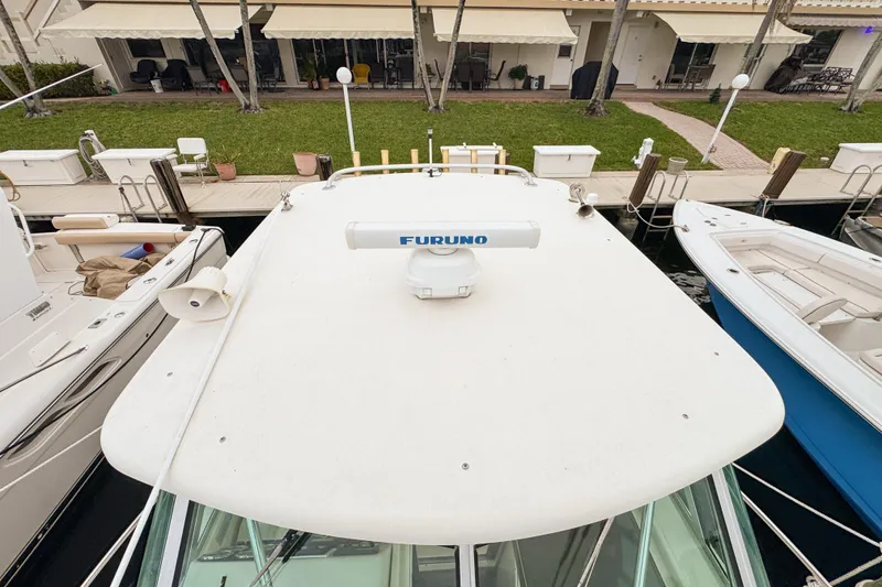 Slide: The Image of 2002 Pursuit 3000 Express boat docked, top view with Furuno radar. - 102