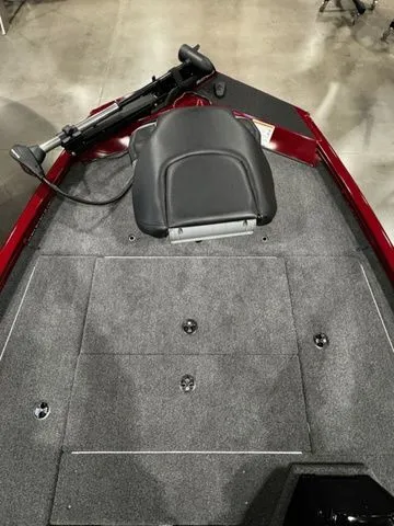 Slide: The Image of 2025 Crestliner XFC 179 boat interior with gray carpet and black seat. - 8