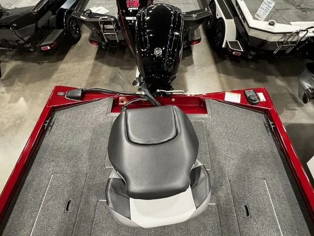 Slide: The Image of 2025 Crestliner XFC 179 boat interior with a central seat and motor view. - 13