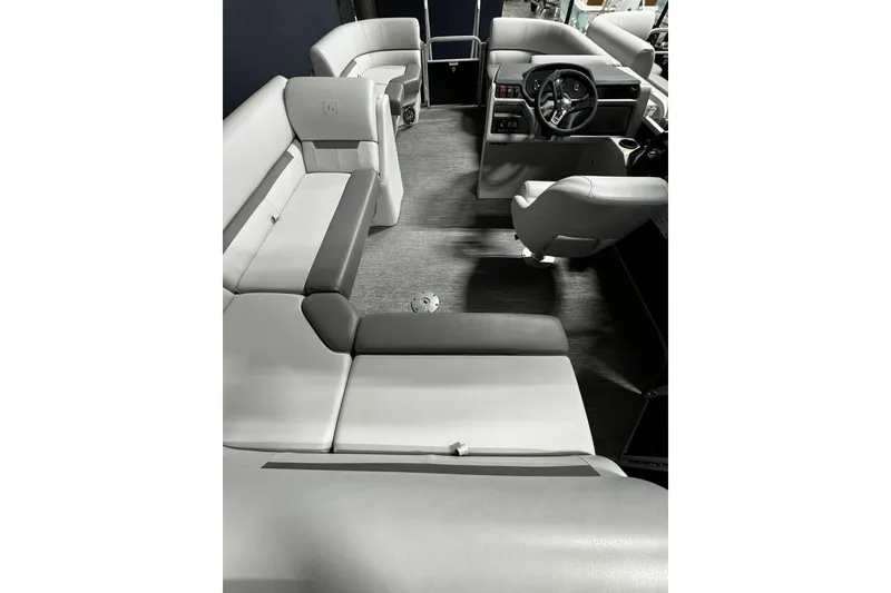 Slide: The Image of Interior of 2025 Godfrey Xperience 1886 CX boat with modern seating and steering console. - 3