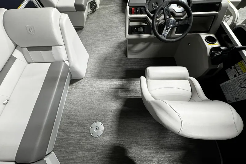 Slide: The Image of Interior of 2025 Godfrey Xperience 1886 CX pontoon boat with modern seating and steering. - 5