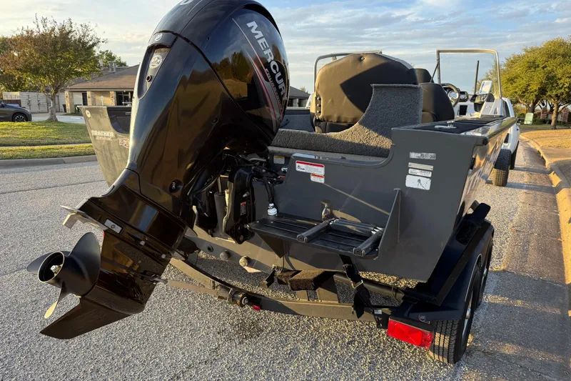 Slide: The Image of 2018 Tracker Targa 18 WT boat with Mercury outboard motor on a trailer. - 13