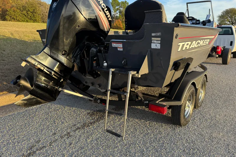 Slide: The Image of 2018 Tracker Targa 18 WT trailer wheels on asphalt, close-up view. - 29