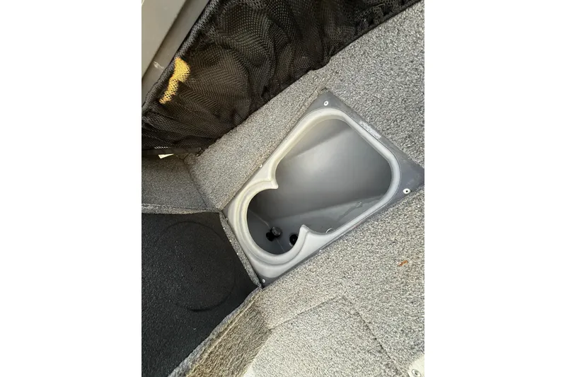 Slide: The Image of 2018 Tracker Targa 18 WT boat storage compartment with coiled cables. - 40