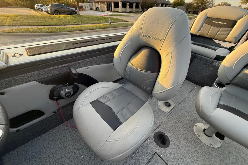 Slide: The Image of 2018 Tracker Targa 18 WT boat seat with motor, outdoor setting. - 48