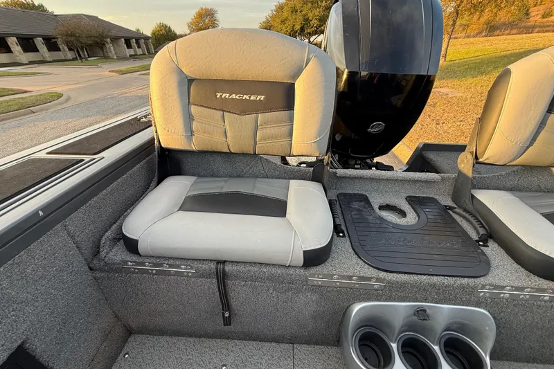 Slide: The Image of 2018 Tracker Targa 18 WT boat dashboard with open storage compartment. - 52