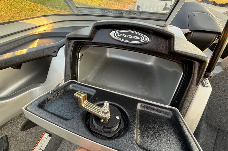 Slide: The Image of Control panel of 2018 Tracker Targa 18 WT boat with audio system and warning label. - 55