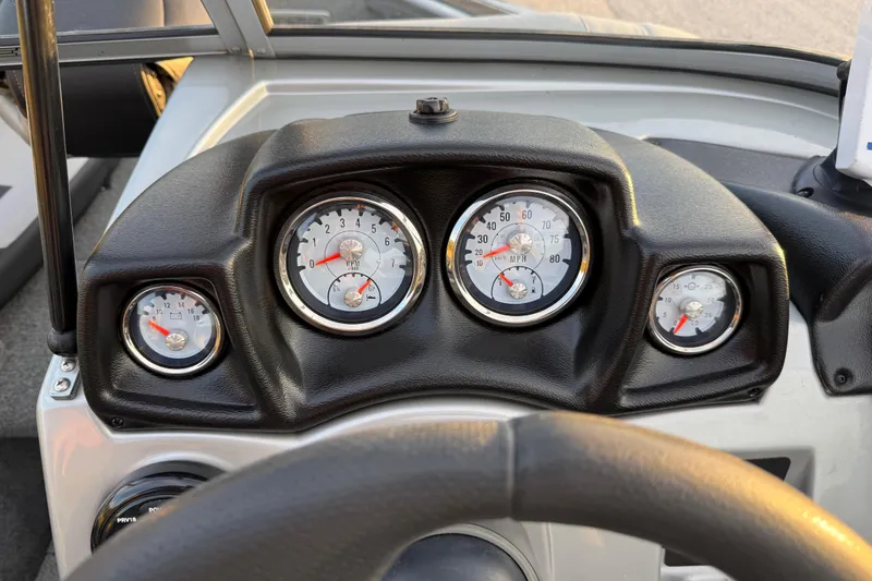 Slide: The Image of 2018 Tracker Targa 18 WT boat interior with gray seating and carpeted floor. - 59