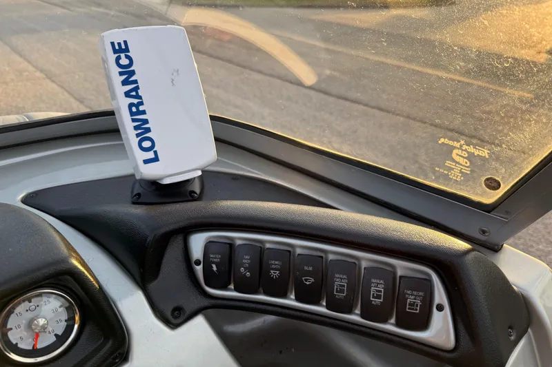 Slide: The Image of Interior view of 2018 Tracker Targa 18 WT boat with sunset in the background. - 60