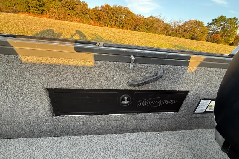 Slide: The Image of Open storage compartment on 2018 Tracker Targa 18 WT boat, showing interior details. - 66