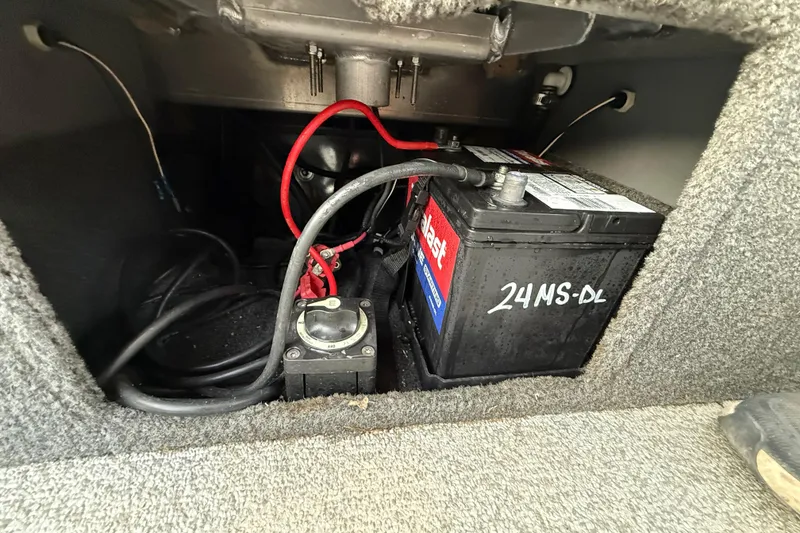 Slide: The Image of Carpeted interior of a 2018 Tracker Targa 18 WT boat with speakers and a fire extinguisher. - 71