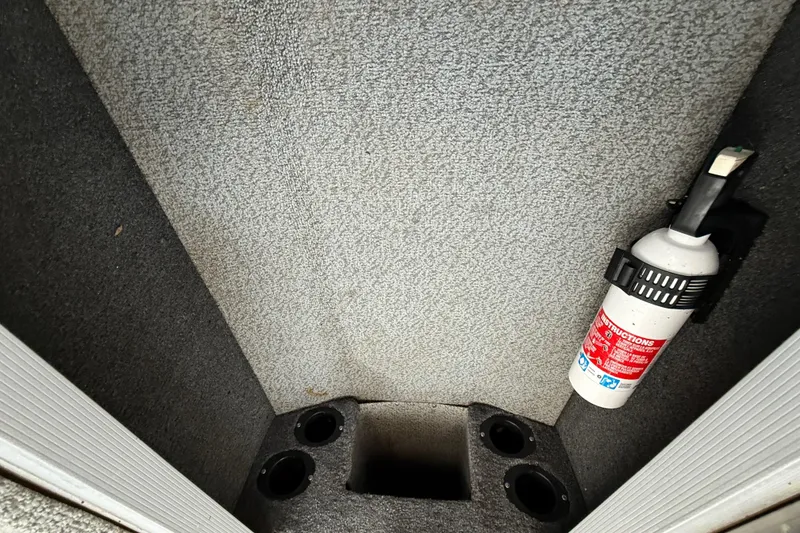 Slide: The Image of Storage compartment of 2018 Tracker Targa 18 WT boat, featuring a clean interior. - 73