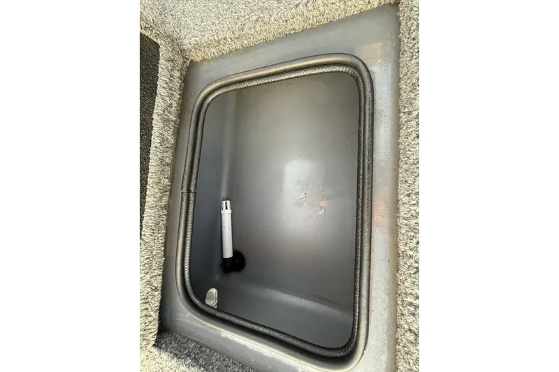 Slide: The Image of 2018 Tracker Targa 18 WT storage compartment interior view. - 76