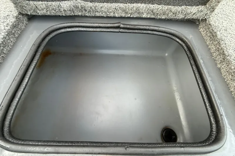 Slide: The Image of Mercury FourStroke engine on 2018 Tracker Targa 18 WT boat, outdoors. - 80