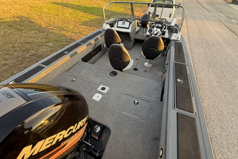Slide: The Image of 2018 Tracker Targa 18 WT boat on trailer by a lake under cloudy skies. - 82