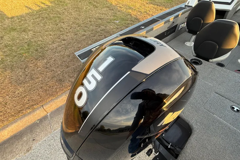 Slide: The Image of 2018 Tracker Targa 18 WT boat on trailer by a lake under cloudy skies. - 85