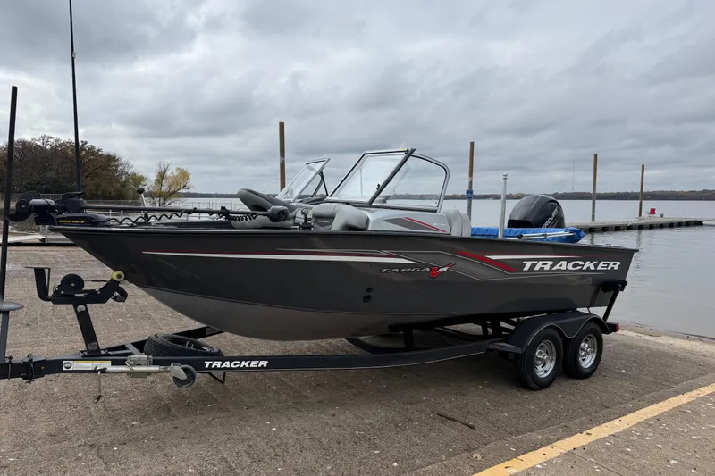 Slide: The Image of 2018 Tracker Targa 18 WT boat with Mercury engine docked by a lake. - 86