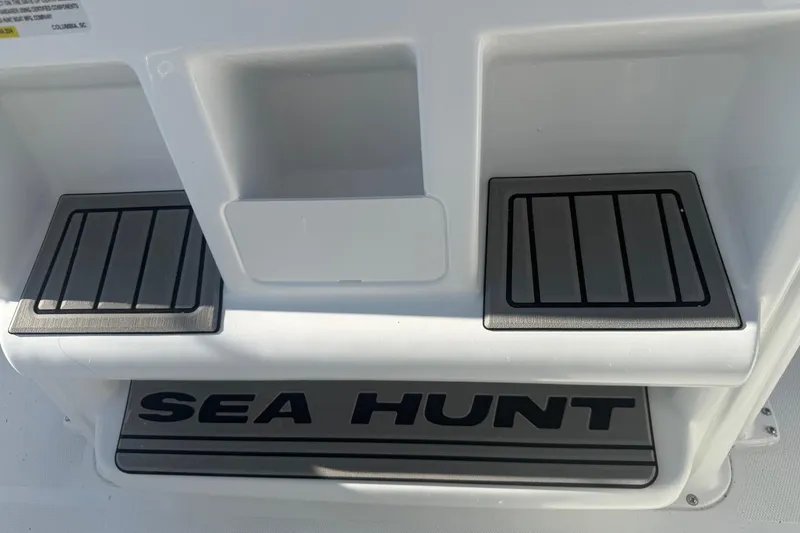 Slide: The Image of 2026 Sea Hunt Ultra 234 boat deck with logo and non-slip steps. - 15