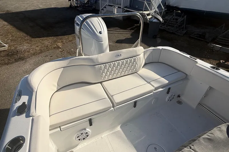 Slide: The Image of 2026 Sea Hunt Ultra 234 boat interior with cushioned seating and modern design. - 2