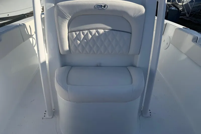 Slide: The Image of 2026 Sea Hunt Ultra 234 boat seat with diamond-patterned upholstery. - 21