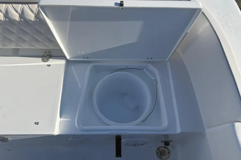 Slide: The Image of Open storage compartment on Sea Hunt Ultra 234 boat, year 2026. - 25