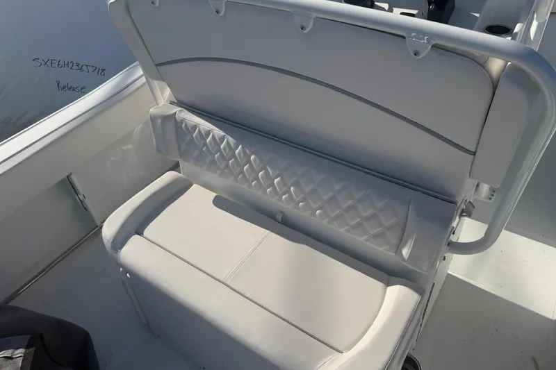 Slide: The Image of 2026 Sea Hunt Ultra 234 boat seat with quilted design and white upholstery. - 7