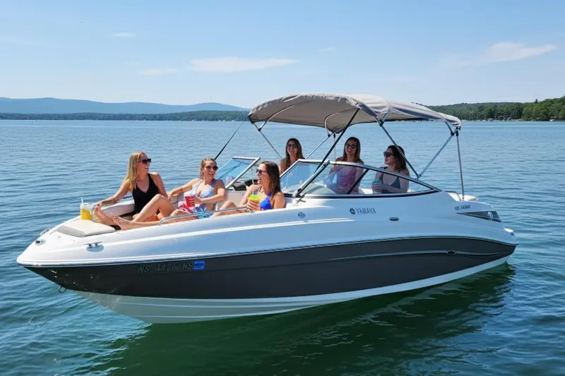 The Image of 2009 Yamaha Boats 232 Limited on a lake with six people enjoying the sun. - 1