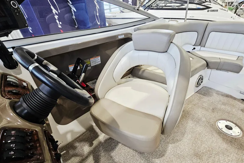 Slide: The Image of 2009 Yamaha Boats 232 Limited interior with steering wheel and seating area. - 12