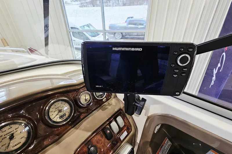 Slide: The Image of 2009 Yamaha Boats 232 Limited dashboard with Humminbird Helix 7 fishfinder display. - 15