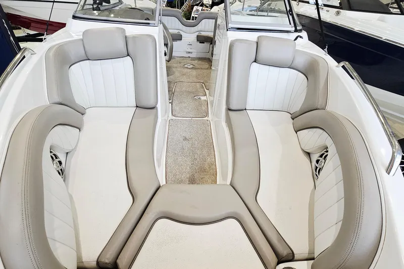 Slide: The Image of 2009 Yamaha Boats 232 Limited interior with beige and white seating. - 17
