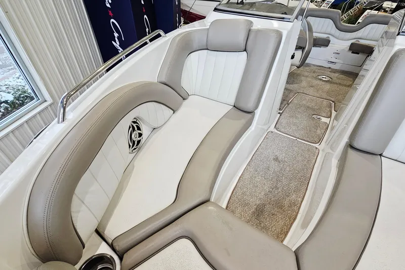 Slide: The Image of 2009 Yamaha Boats 232 Limited interior with plush seating and carpeted flooring. - 19
