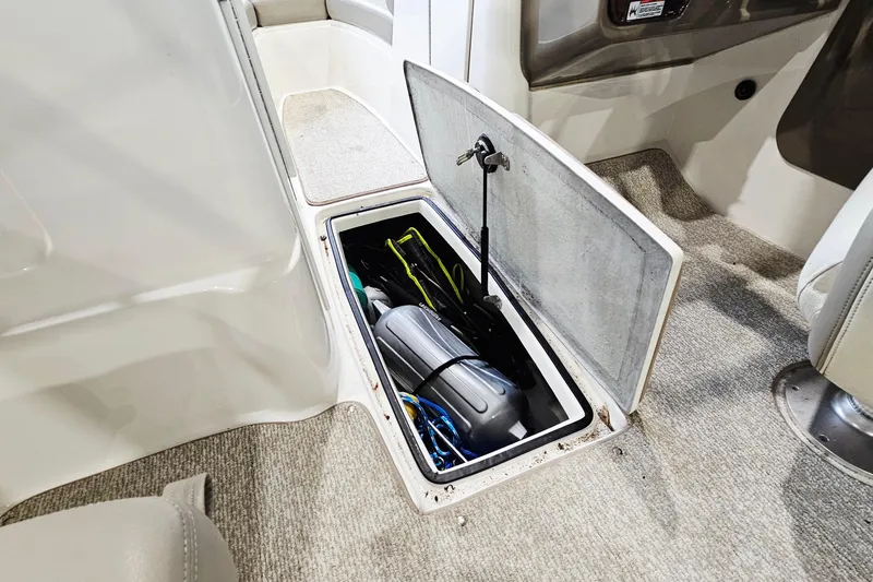 Slide: The Image of Storage compartment in a 2009 Yamaha Boats 232 Limited, showcasing interior space and equipment. - 21